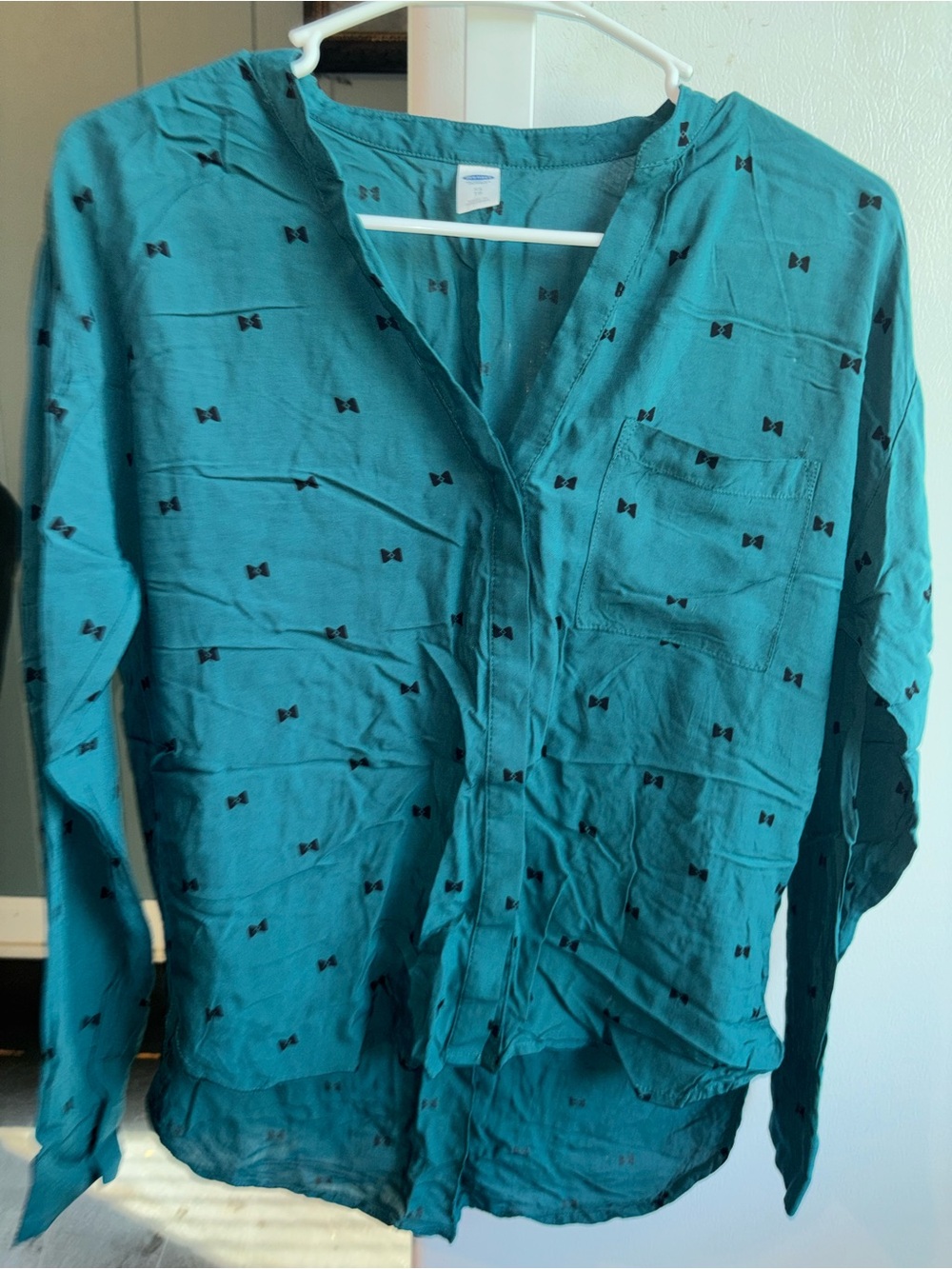 Teal Long-Sleeve Button Front Shirt with black bows.
